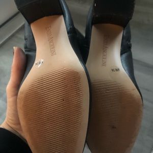 Black leather to the knee boots